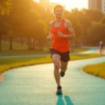 Focused runner navigating a colorful urban park path at sunset, captured mid-stride with a look of uncertainty that reflects the challenge of overcoming a training plateau.